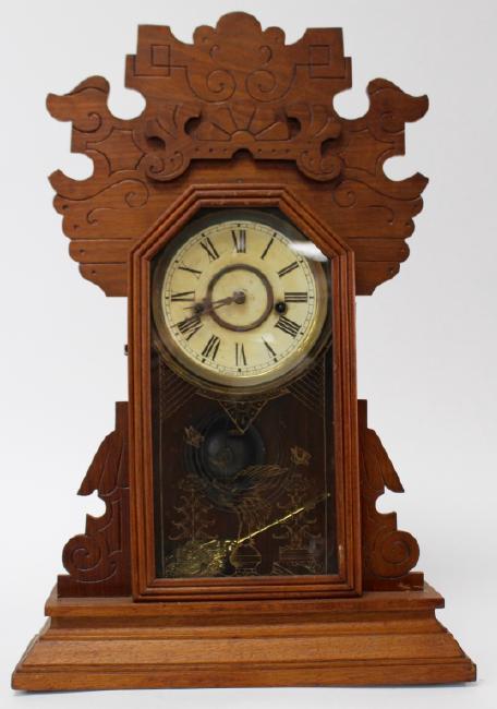 Late 19th century carved Oak case kitchen clock by Waterbury Clock Co