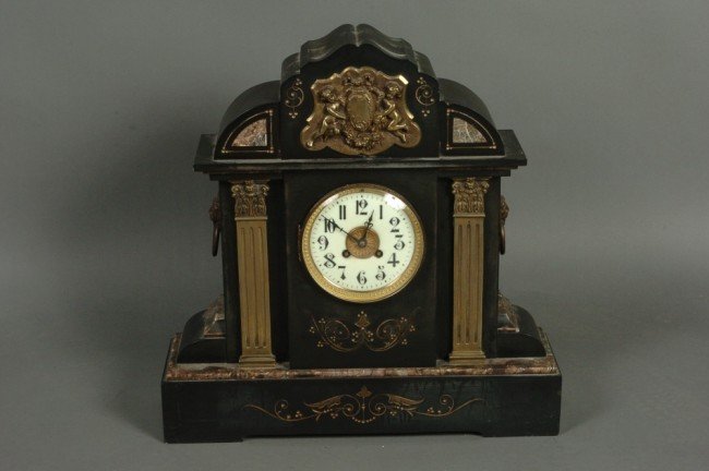 A BRONZE MOUNTED SLATE MANTEL CLOCK W/ JAPY FRERES