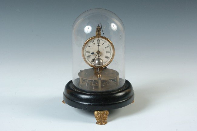 A BRIGGS ROTATING PENDULUM CLOCK BY WELCH