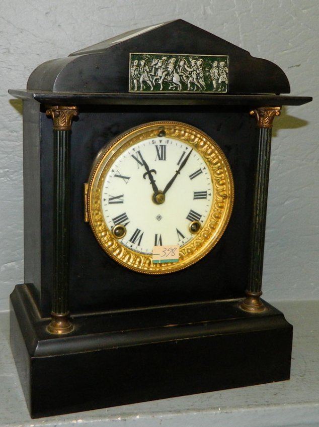 Ansonia 8 day clock w/ silver plaque of soldiers.