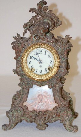 Ansonia Metal Clock w/Cherubs Porcelain Insert