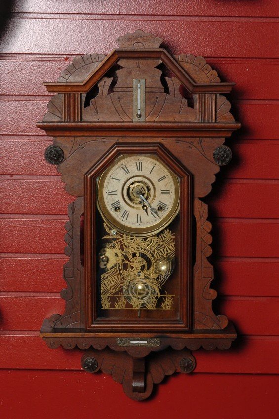 A FANCY WALNUT HANGING KITCHEN CLOCK