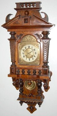 Antique Walnut Free Swinger Clock