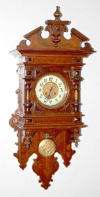 Ornate Antique Walnut Free Swinger Clock