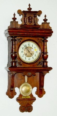 Antique Walnut Carved Free Swinger Clock