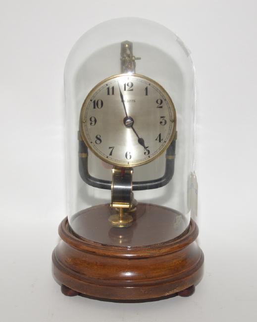 800 Day Clock on wood base with glass dome.  Ht. 10