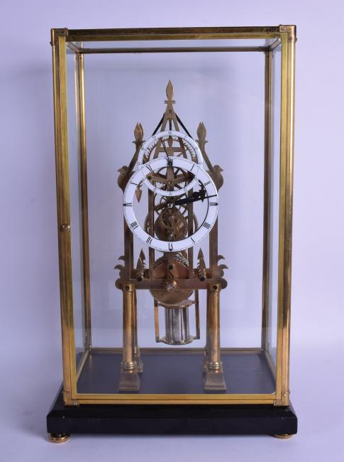 A CONTEMPORARY DOUBLE DIAL SKELETON CLOCK with white