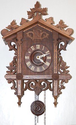 Black Forest Carved Inlaid Cuckoo Clock