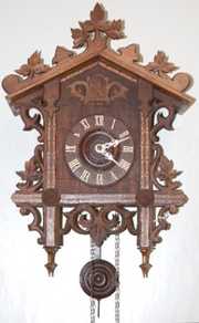 Black Forest Carved Inlaid Cuckoo Clock