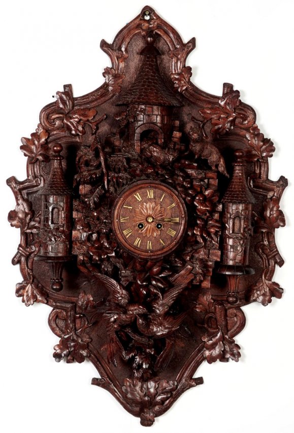 A HIGHLY CARVED BLACK FOREST CASTLE WALL CLOCK