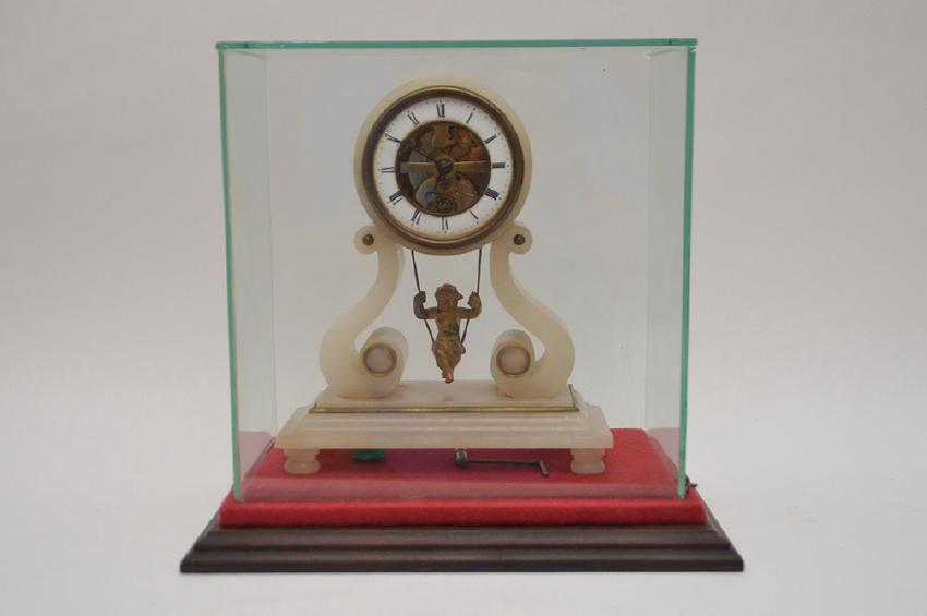 Antique Alabaster Clock with swinging child pendulum.