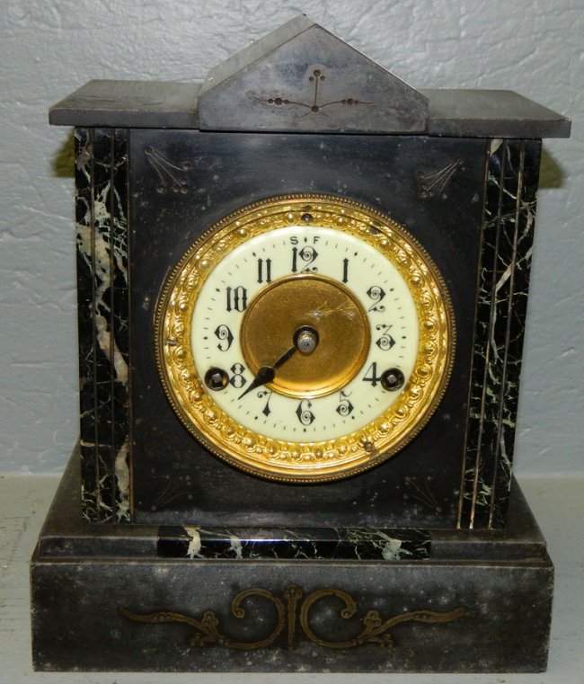 Ansonia black marble mantle clock w/brass door.