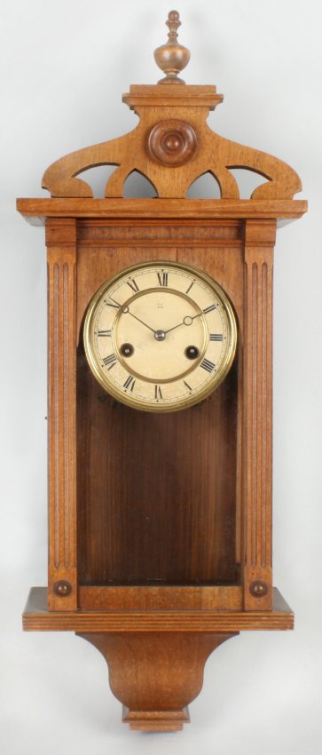 A fruitwood cased spring driven Vienna wall clock.
