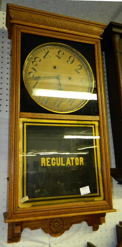 8 day American Regulator oak wall clock.