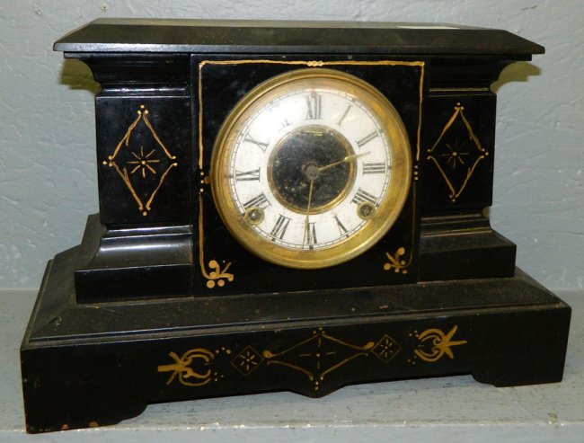 Black iron case Ansonia shelf clock .