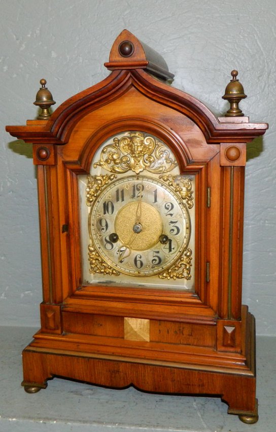 French shelf clock w/steeple top and brass face.
