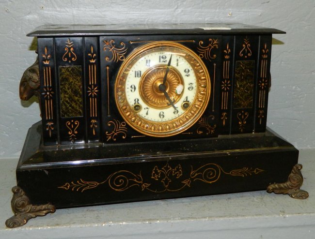 Iron Ansonia mantle clock w/rams head detail.