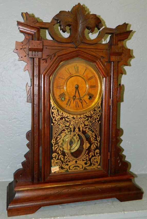 Carved walnut rooster head 8 day mantle clock.