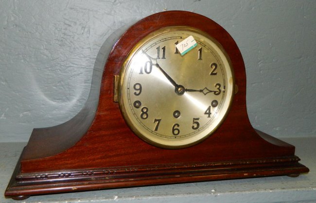 8 day German mahogany clock. 16″ x 10″.
