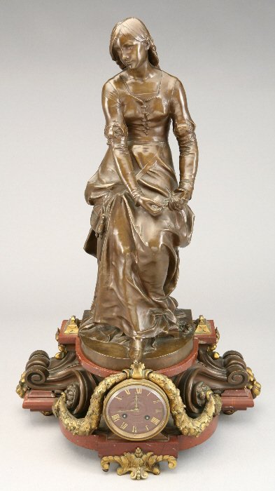 French bronze and marble figural clock of a