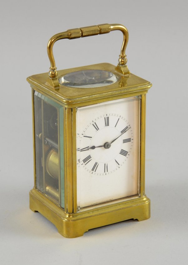 French brass carriage clock striking the hours and half