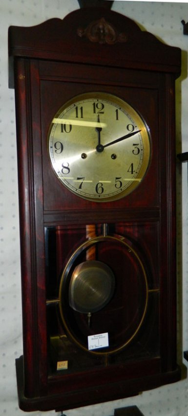 Walnut 8 day brass  wall clock w/ beveled glass.