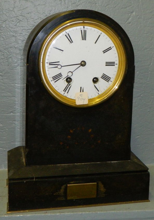 Marble clock on brass base w/ Roman numerals.
