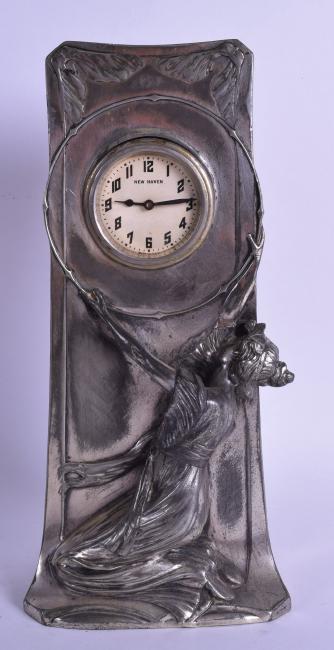 A FRENCH ART NOUVEAU SILVERED SPELTER MANTEL CLOCK