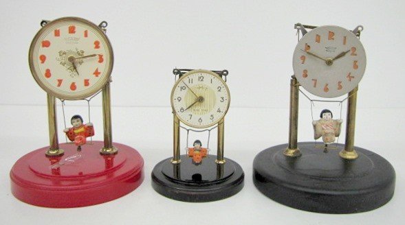 3 Oriental Swinger Dome Clocks