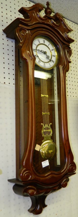 Carved walnut Korean clock w/ 31 day movement.