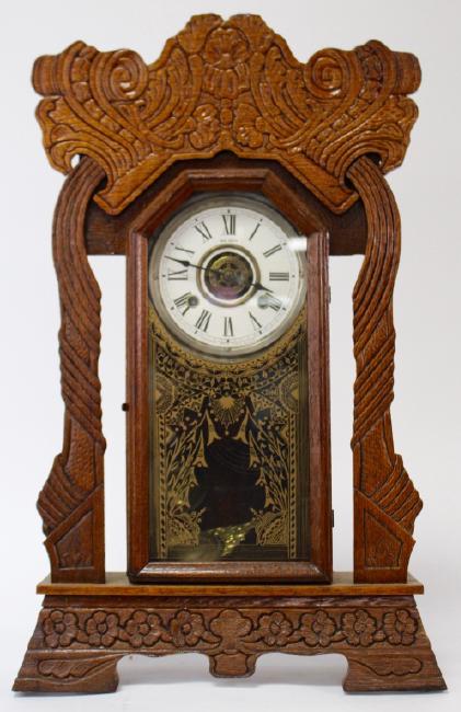 Late 19th century pressed Oak case gingerbread clock by New Haven Clock Co