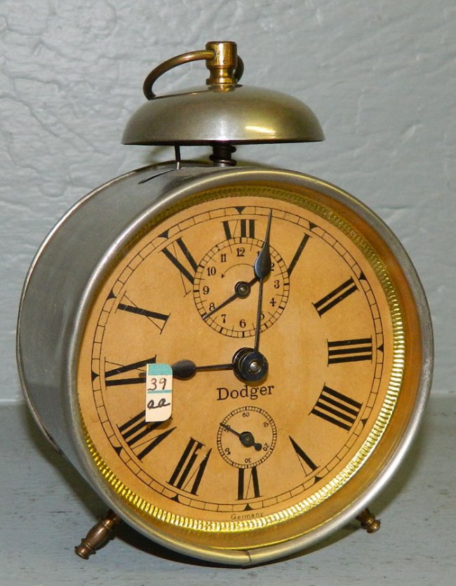 One day tin case alarm clock with German ball.