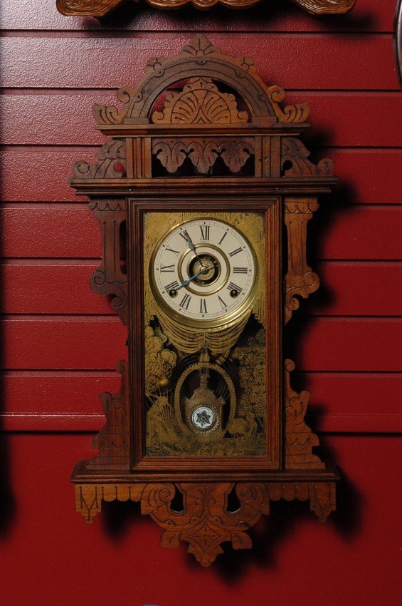 AN E.N. WELCH ‘ECLIPSE’ HANGING KITCHEN CLOCK