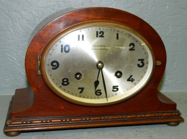 English Kemp Bros. head and shoulders clock.