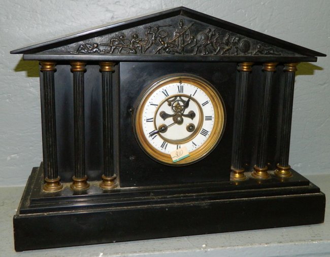 Marble 8 day mantle clock w/soldier inlay.