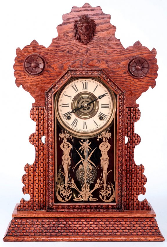 AN INGRAHAM OAK KITCHEN CLOCK CIRCA 1890