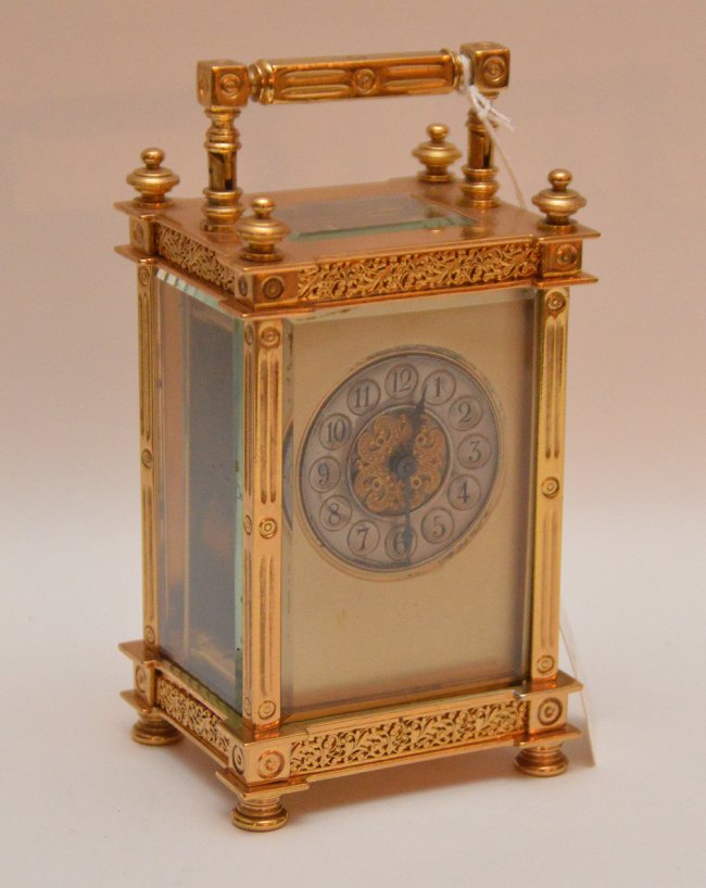 Antique Gilt Brass Carriage Clock with swing handle.