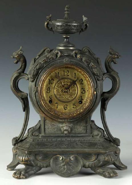 A CIRCA 1890 AMERICAN SPELTER CLOCK WITH GRIFFONS