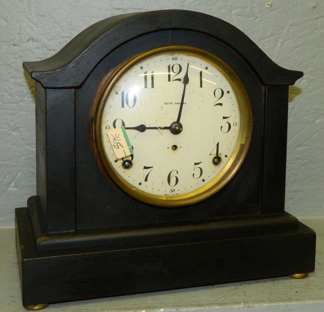 Seth Thomas black painted clock w/ enamel dial.