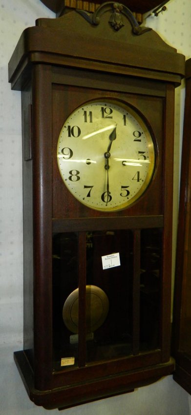 8 day pendulum wall clock w/glass panels.