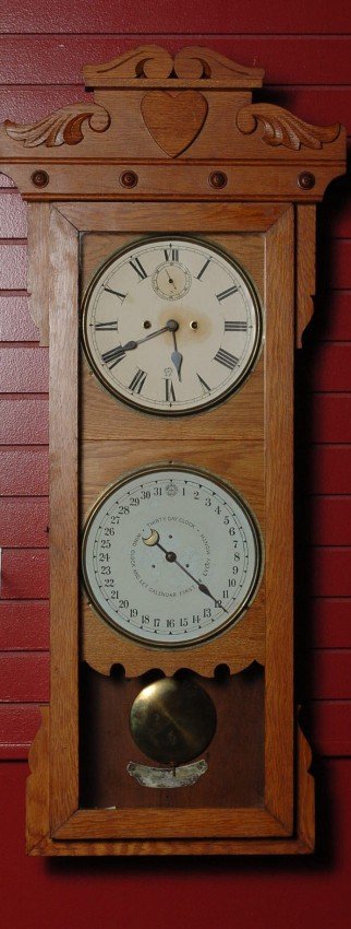 A NEW HAVEN DOUBLE DIAL CALENDAR CLOCK