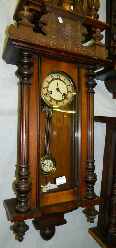 Mahogany case 8 day wall clock .16″ x 22″.
