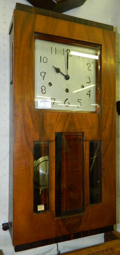 Velvet wood 8 day chiming wall clock.