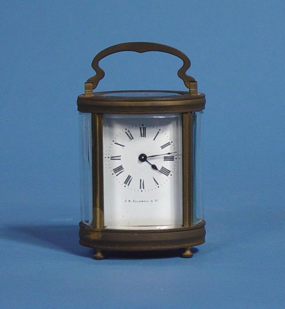 Small Brass Oval Carriage Shelf Clock