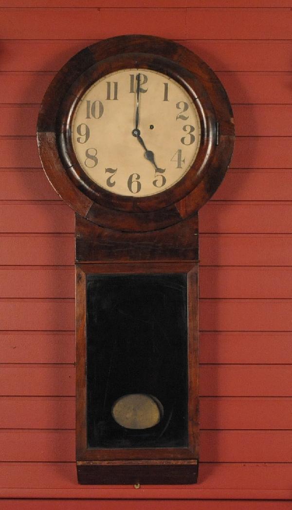 A MAHOGANY VENEERED ANTIQUE WALL CLOCK