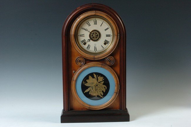 AN INGRAHAM 18 INCH ROUND TOP SHELF CLOCK