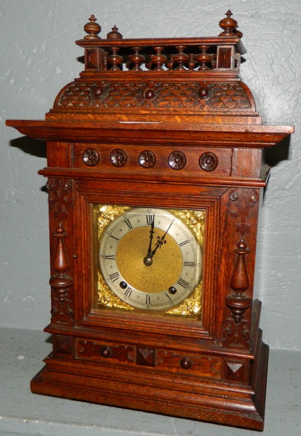 Oak case German eight day shelf clock.