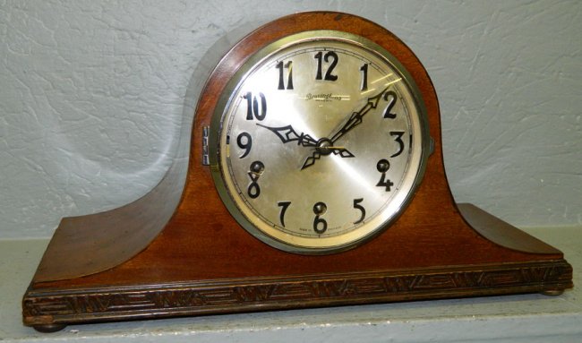 French head and shoulders chiming clock.