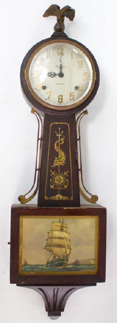 Early 20th century Walnut cased presentation banjo clock by Elias Ingraham Clock Co