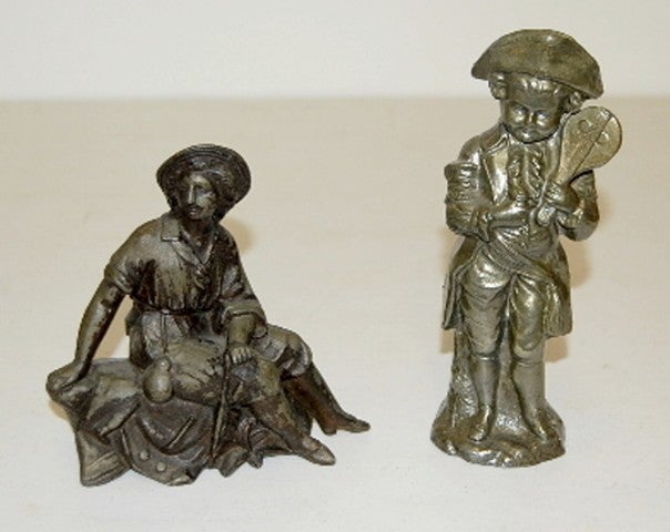 2 Metal Clock Statues